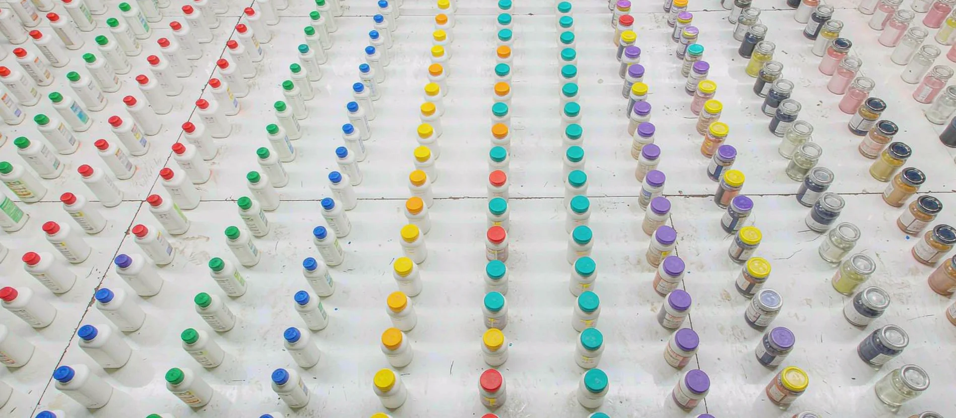 Rows of dyed yarn cones in a textile mill