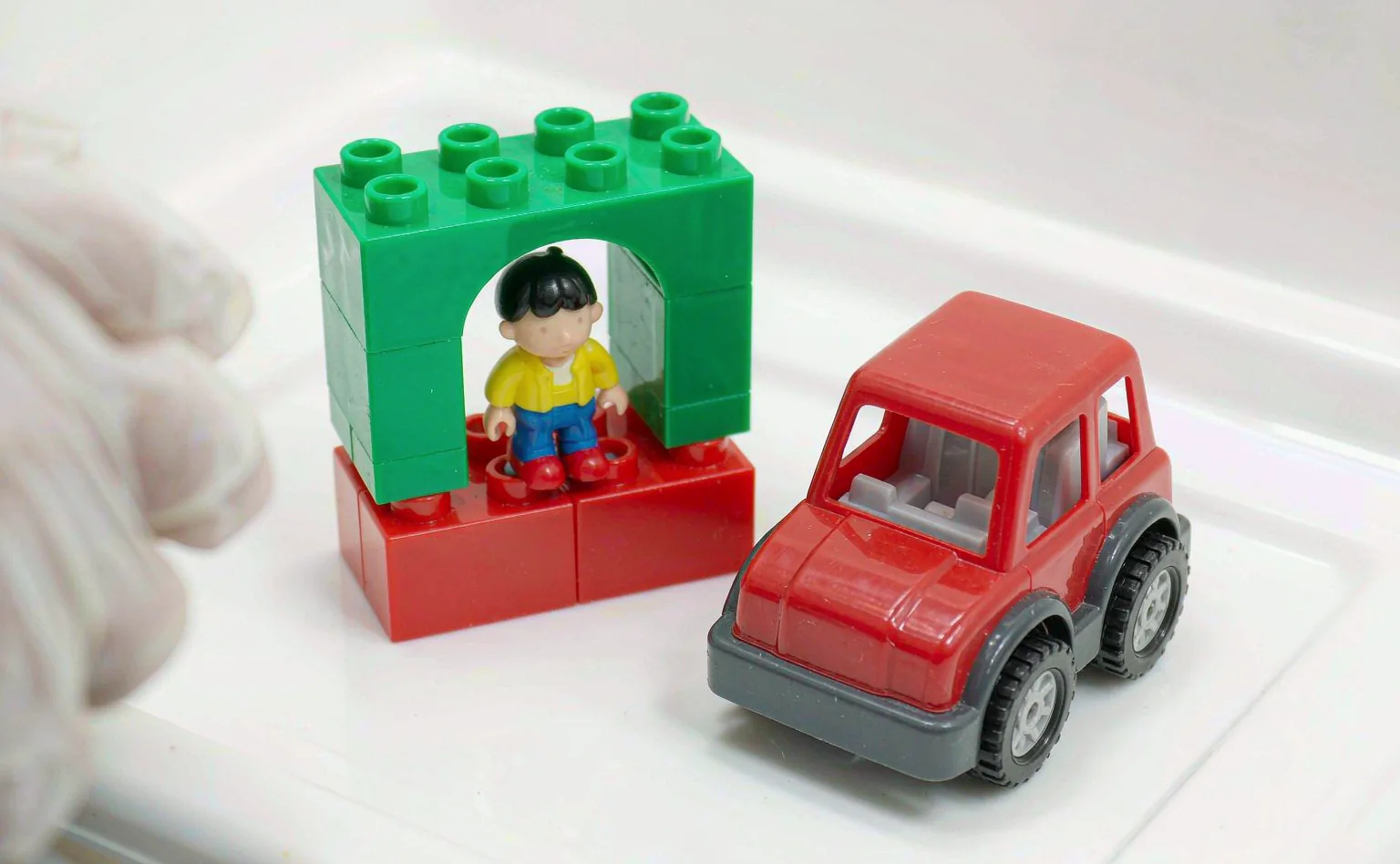 Molded plastic toys and building blocks arranged for safety testing