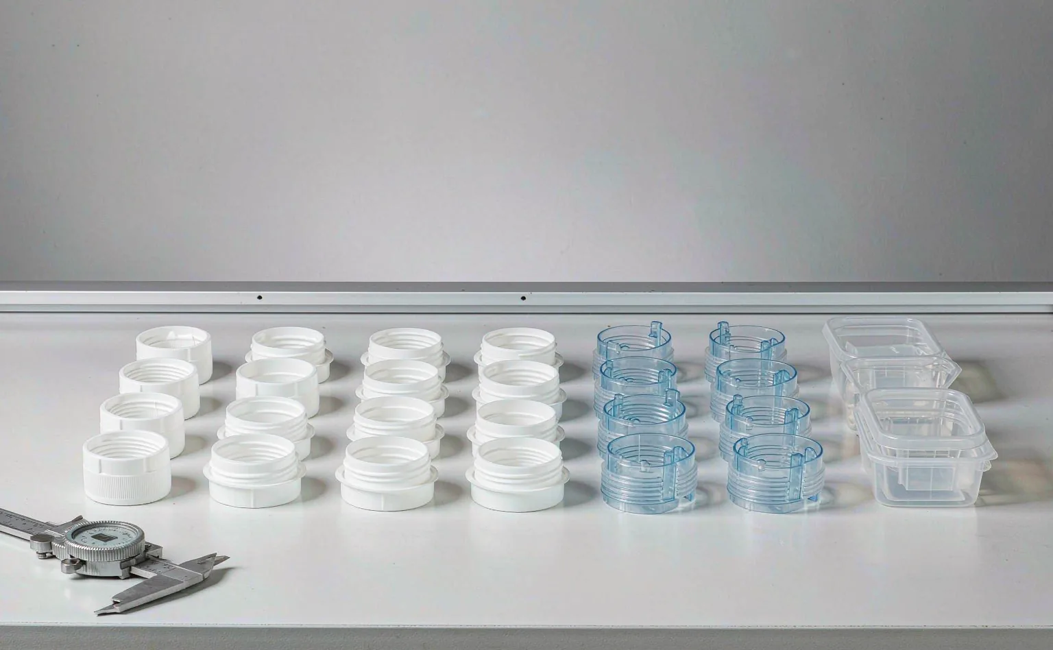 Inspection of molded caps, closures and plastic containers