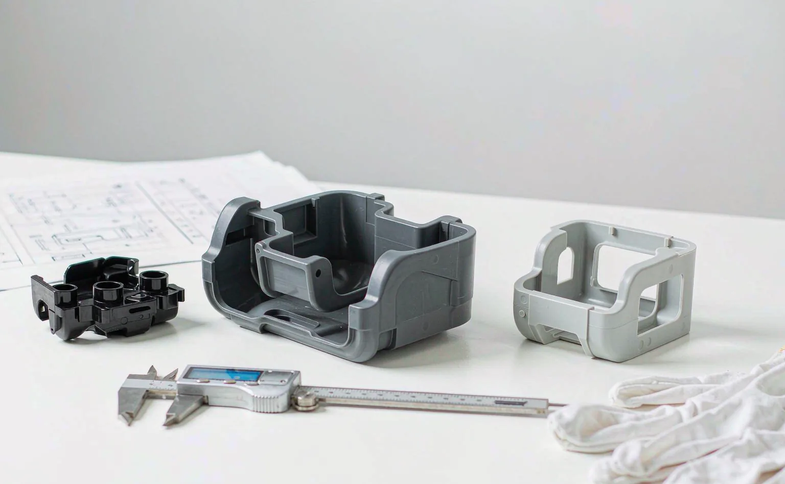 First articles from a new mold measured against the drawing on the inspection bench